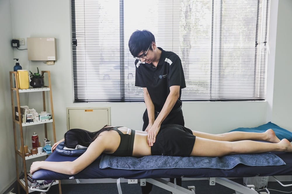 physio treating lower back pain